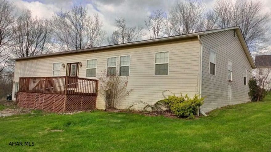 Ranch style home with very spacious rooms on 2+ acres, detached storage building, integral garage.