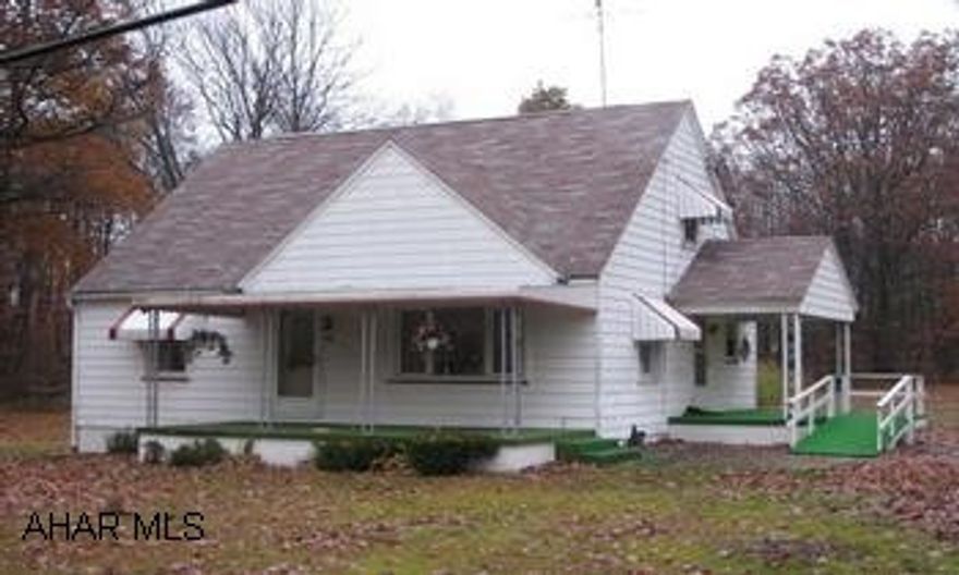 Outdoorsmens Paradise! 2 story cape on 2.64 acres, next to state game lands on Viola Pike. Mo. Valley SD. 3-4 bedroom, 3 detached garages, oil, wood, coal combo furnace, partially furnished!