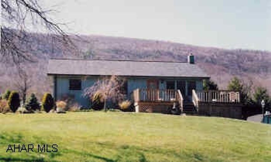 Ranch home with vaulted ceiling, 2BR, 2BA on 3/4 ac, newer wraparound deck, roof, heat and cemtral air. Good view.