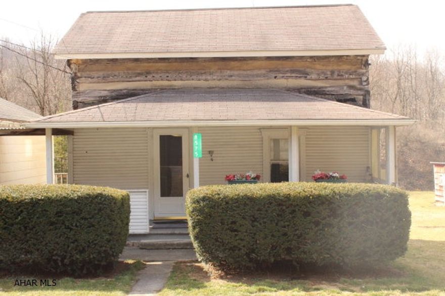 A charming old log cabin that can be zoned Residential or Commercial. Home has a lot of potential. Addition has Large Bathroom which contains washer and dryer Hook ups. Master bedroom has his/hers closets & access to back deck. Large walk through basement.  Detached one car garage with work bench and pull down storage. Plenty of parking space for visitors in the driveway. Large yard with Shed. This could be an investors dream or a great location for a business.