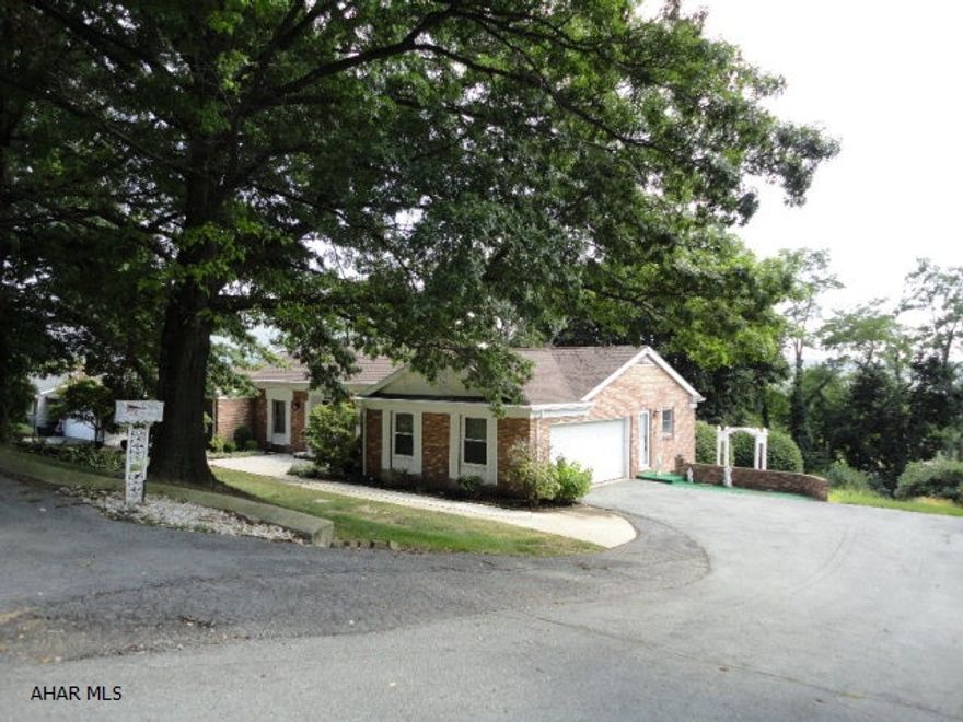 Hardwood floors, large driveway, mature landscaping, move right in.