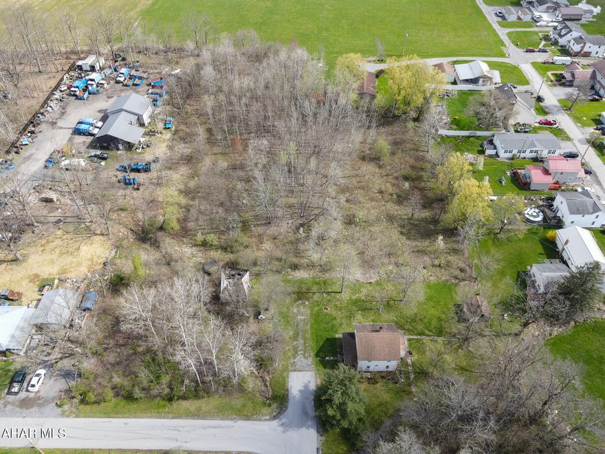 House is sold with ground and house. Home could be fixed up for residential or income property.