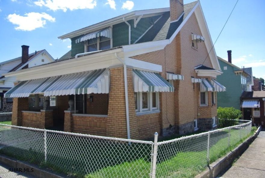 Large, spacious brick home with lots of character.  3 large bedrooms and 2 bathrooms.  You couldn't find a better home for less!  Updated electric system and chimney. Large partially finished basement.  Cute fenced yard and convenient location.  Owner will consider new sink and counter top installed with the right offer.