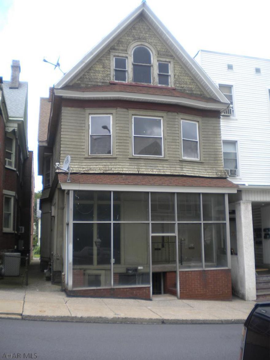 Investors come take a look at this great  income making potential opportunity! 3 unit apartment building offering two 2 bedroom 1 bath units and a three bedroom 1 bath unit. Also a partially finished attic.  Each unit includes a stove and refrigerator. Off street parking in the rear. Separate heat and electric. First floor has air conditioning units.