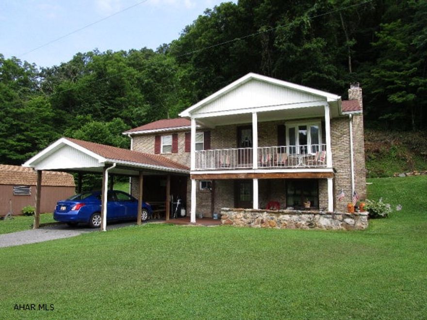 This one-story home offers 3-beds, 2-baths, LR, Kit and DR on the main level.  It rests a on a full basement with a large family, brick fireplace with wood burner insert and a finished bonus room.  Full walk-out basement to a covered porch.  Updated heat pump with central air, one-car carport and storage buildings.  Large 5.6 acre lot that's mostly open with a stream passing through.  The home is very well maintained and has been rebuilt and added onto over it's life.  Very serene setting with the stream, back from road with a macadam driveway and close to state forest lands and lakes.