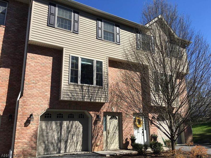 Luxury 3 Bedroom Town Home.  Three completely finished floors.  Quiet area.  Wooded to the rear for privacy.  Beautiful hardwood floors and ceramic as well.  Eat in kitchen as well as a formal dining room.  Two tiered deck.  Upper deck is off the kitchen.  Bottom Deck is off the family room and offers a  completely private Spa area with Hot Tub.  Hot Tub will be included with an acceptable offer.  HOA fee of $60/month covers Lawn Care and Snow Removal.  Freshly painted.  New carpet in family room.  New Blind for Living Room is ordered and will be installed May 11th.  New shrubs coming too!