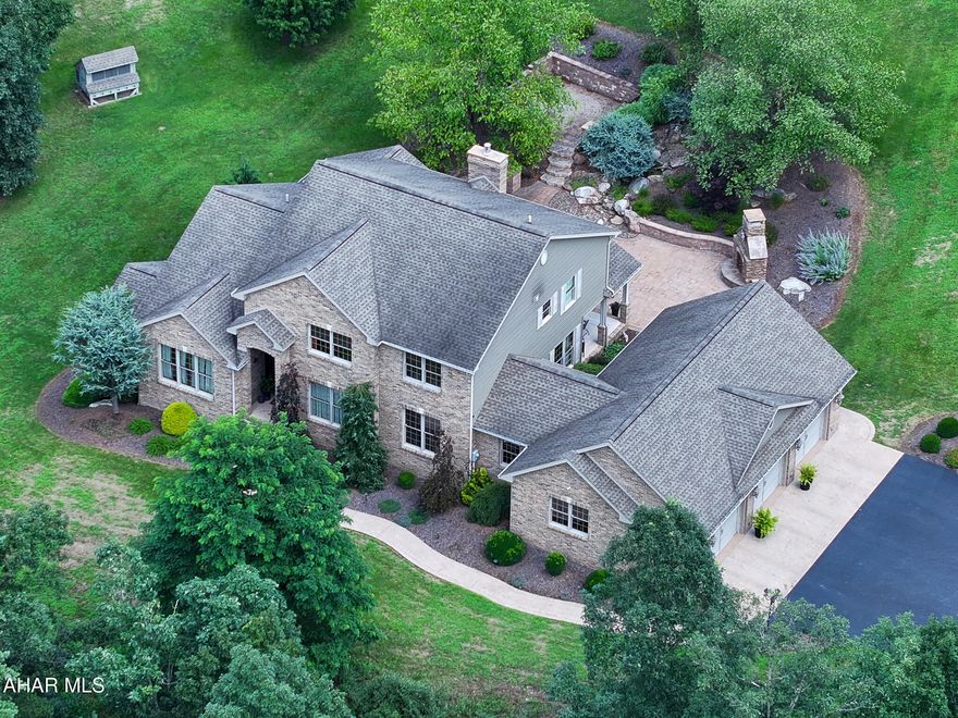 Stunning Custom Built Brick Estate on 23.83 acres. Drive up to the gate that opens to your own private paradise. 6 bedrooms , primary bedroom is on main level with 2 walk-in closests and amazing bathroom. 4 bedrooms upstairs with full bath, bedroom 6 is in the finished  basement.   Gourmet kitchen with granite countertops, custom made granite sink. wraparound counter, kitchen is full of unique features and lots of great lighting.  Has a cozy breakfast nook. Main level laundry room. Cozy family room with gas fireplace, formal dining room , formal living room off the spacious front foyer.  Finished walk-out basement has kitchenette , large family room with another gas fireplace perfect for friends and family gatherings. Hidden gem is a  secure safe room, lots of storage and utility room. Beautiful flooring thru-out the entire home, tray ceilings , crown moldings . You must see all the beautiful extras to appreciate. 
Outside living shines with a covered patio,  landscaped gardens, outside stone fireplace and soothing water features.
Additional Highlights include:
Heated 3 car attached garage with epoxy flooring.
Separate detached garage for your outside toys/camper/tractors etc.
Fenced in farmers area with outbuilding.
Chicken coop and custom playhouse.
Home is a private oasis , peaceful and move-in ready , luxury country living just minutes from town!