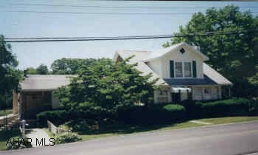 HUNT OR FISH ON YOUR OWN PROPERTY.  THIS FOUR BEDROOM HOME FEATURES TWO BATHS, MULTI-LEVEL DECK WITH POOL ON 2 ACRES OF PARTIALLY WOODED GROUND.  HEATED 2 CAR GARAGE WITH 2ND FLOOR.