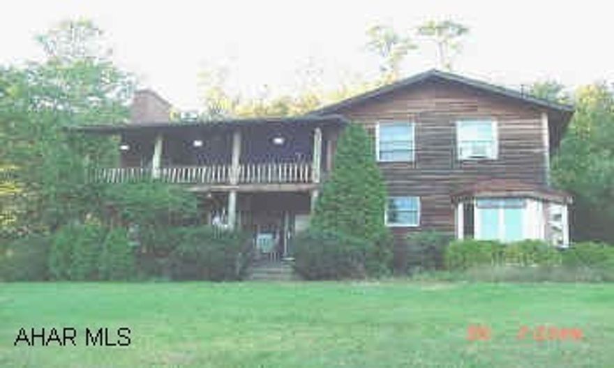 2 Story Hemlock Sided Home, 2,500 Sq. ft., 4 Bedrooms, 2 Baths, Corner Breakfast- Nook, Gas Fireplace in Livingroom 19.8 Acres, 4 Stalh horse barn w/ tack room. Custom built 2 Story w/ 1St. Flr. BR. & BA., MBR Suite has Whirlpool & Shower for 2.  Walk-in Closet. Basement has Root cellar & workshop.  300 well water storage tank in basement.