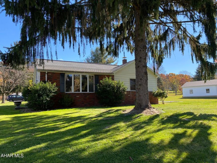 The home is situated on a beautiful lot with mature trees.  Large eat-in kitchen and living room with plenty of room for entertainment.  The large two car garage has a second level for storage.  Take a look for yourself.