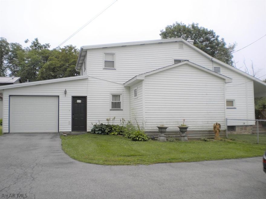 Well maintained 4 bedroom 1 bath home with tons of garage space & a workshop.  Home has a 1 car attached garage and there are also 2 separate detached garages with the property. There are 2 separate deeded parcels being sold together. 31-16-115 and 31-16-116. Lot sizes are 93.6x120 and 49.2x205 Low taxes! Cozy back porch to sit and relax. Heat Pump on both house and workshop/garage with C/A.