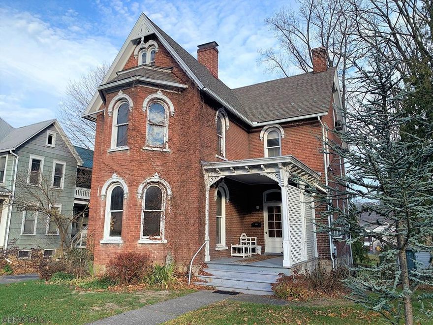 Beautiful, full brick, victorian home in the heart of Bedford Borough!! This home boasts so many authentic features that are rare to find today; original arch top windows w/ matching arched wood trim, handcrafted/detailed exterior wood trim, interior window transoms, original interior doors and trim, & curved wood staircase. 1st level has a foyer, LR w/ soapstone FP mantel, DR w/ closets, kitchen w/ eat-in area, & laundry w/ half bath. 2nd level has 3- sizable bedrooms & a full bath w/ clawfoot tub. 3rd level has two finished rooms w/ one being a sitting/bedroom and another as a guest bedroom. Spacious home, full walkout basement w/ hand stacked stone foundation, & front & rear porches. Large street to alley lot, storage shed, & wrought iron fencing. Don't miss this original Bedford gem!!