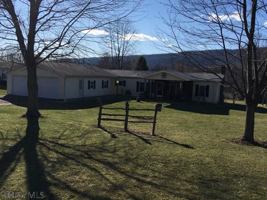 Nice 3 bedroom 2 bath on 1 acre. Large eat-in kitchen and large dining room, mud room and office/den area off living room. Master bedroom with walk-in closet, master bath separate shower and a garden tub. Skylights in kitchen and baths.  Oversized 24x32 garage with a drive through access to carport/patio. Large outbuilding used as a workshop and lawn mower storage and a chicken coop. There is a hook-up for a generate. Laundry on main FL  and basement hook up.  High ceilings in basement great for finishing. Outside access from basement.  Chimney with stainless steel flu.