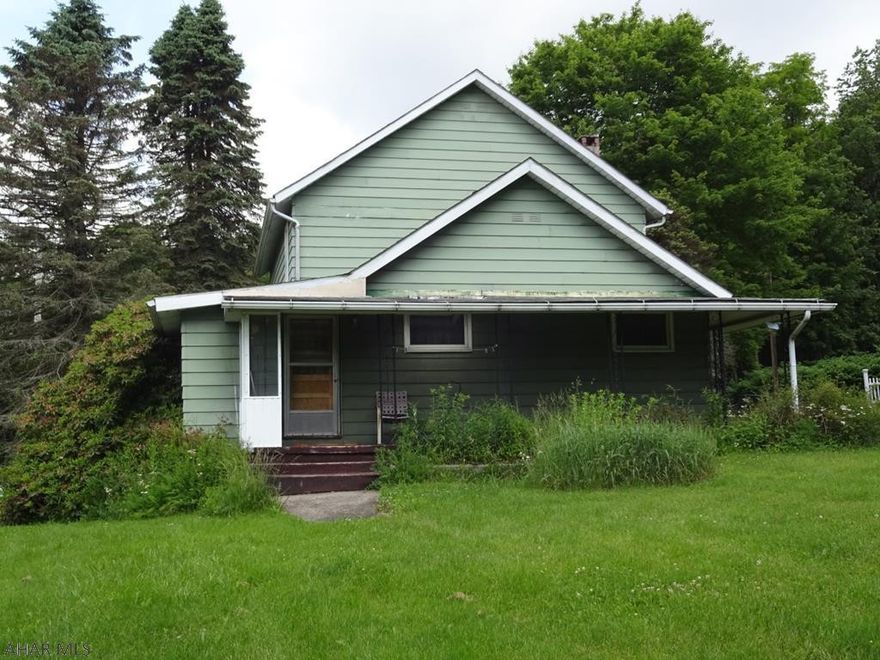 Ashville - Older home on country setting, 4 BR, laundry on 1st floor,  2 furnaces - oil & coal, 6-9 car concrete block garage on .459 acres.  $49,000