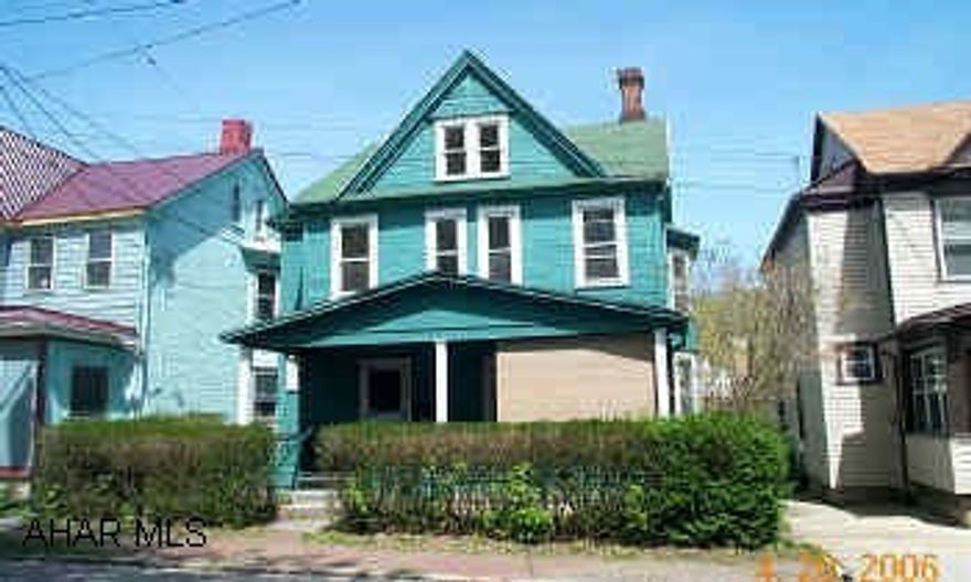 2 buildings on lot - 1 BR single family - 1 double house in rear 3 units w/ separate utilities - all occupied - w/ leases - net over $12K /yr