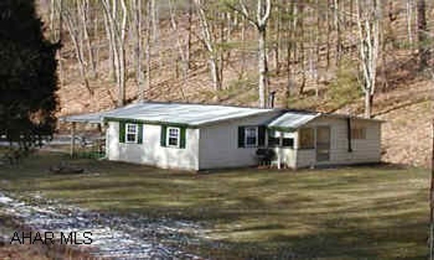 Nice cozy two bedroom bungalow loads of interior work done. New furnace, 200 amp service, bathroom,new hardwood floors and new carpet on 5 acres !!!!    Nice cozy two bedroom bungalow loads of interior work done. New furnace, 200 amp service, bathroom,new hardwood floors and new carpet on 5 acres !!!!