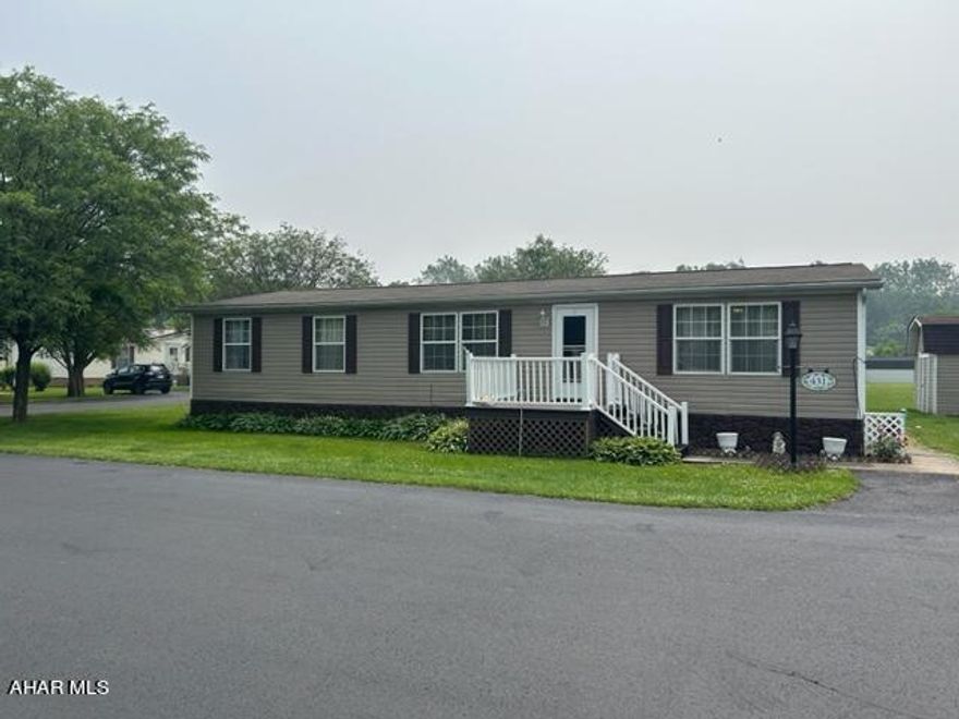 Nice Ranch home on corner lot with 3 Bedrooms and 2 Full Baths ,Rear Deck with Awning ,Large Storage Shed,New Hot Water Tank,Newer Roof in 2022,Most rooms have been Dry walled,Nice Front Porch with Vinyl Railing,Corner Lot ,Move In Ready !  55+ Community Lot#74.