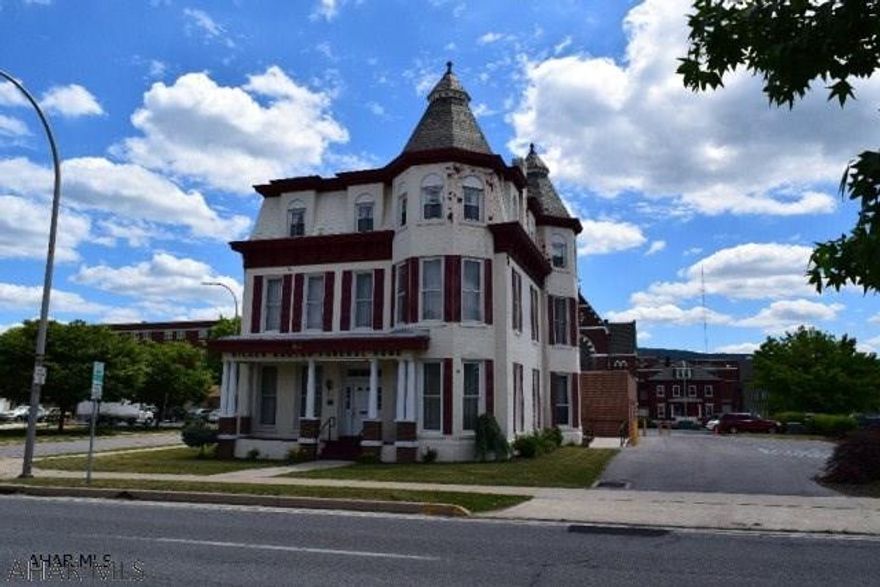 This magnificent 3 story home is a piece of Altoona history. Originally built in 1888 as a physicians residence. The home sits on a new foundation after its move from its original location on 8th Ave in 2006. The original woodwork, marble fireplace and 10 ft. ceiling are impressive. This could be used as a large single family home, several luxury apartments or professional offices. The second and third floors have been used as apartments in the past. The property has a private parking lot for six vehicles and the attached garage has two large connecting bays. The freight elevator rated for 1,000 lbs. is from the basement to the third floor and the first floor is ADA compliant, complete with ramp access from the parking lot.