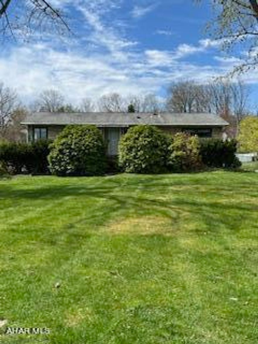 Super location! 1.19 AC Brush Mountain Road. 3BR 2 BA Rach with 4-car attached garage. LR, EI Kitchen, MBR, BA, BR, BR, Full - partially finished basement, GFA, Central Air.