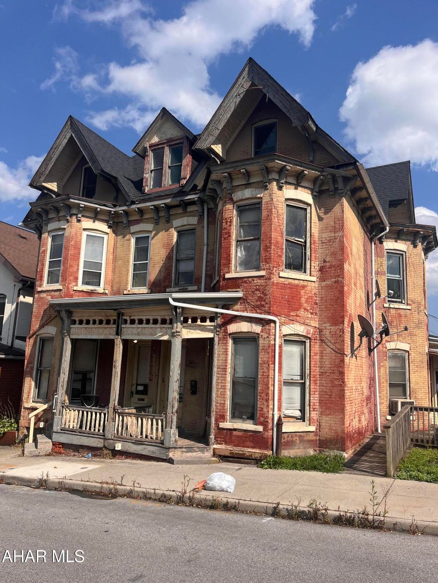 This 4-Unit Brick building offers some historical value. Original tin ceilings in one unit. Currently one long term tenant ($750/mo). The other units would be in need of renovations but offer great space and potential. One side has GFA and the other is in need of a new heat source. Roof was put on in 2017. 2 meters for Gas, water & electric. All units would be 1-2 BR's depending on set up.