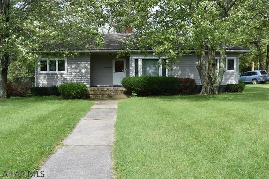 Location! Location! Location!  This home is situated on a beautiful, flat, corner lot in a quiet neighborhood.  One owner, custom built home.  There are hardwood floors throughout under the carpeting. This home is being sold AS IS.  Seller wishes to make no repairs.