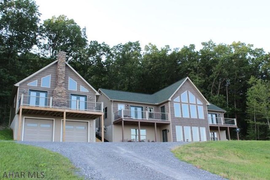 Stunning 3 bedroom 5 bath home on just over 5 acres. This 2013 custom built home has everything you need and more! Each large bedroom offers its own private bath, large closets and the 2 bedrooms on the main level have access to the balcony.  Enjoy the breath taking views from the main floor balcony while the natural sunlight shines throughout the home. Opening to the living room, the kitchen features beautiful  Craftmade cabinets,  granite coutertops, hardwood flooring, SS appliances, and a built in wine cooler. The detached 2 car garage features a 1 bedroom 1 bath suite upstairs overlooking Martinsburg. Along with a great private location, the 5.02 acres adjoins to state game lands for hunting. Call listing agent for your private tour.  PRE-APPROVAL required, please don't drive up lane.