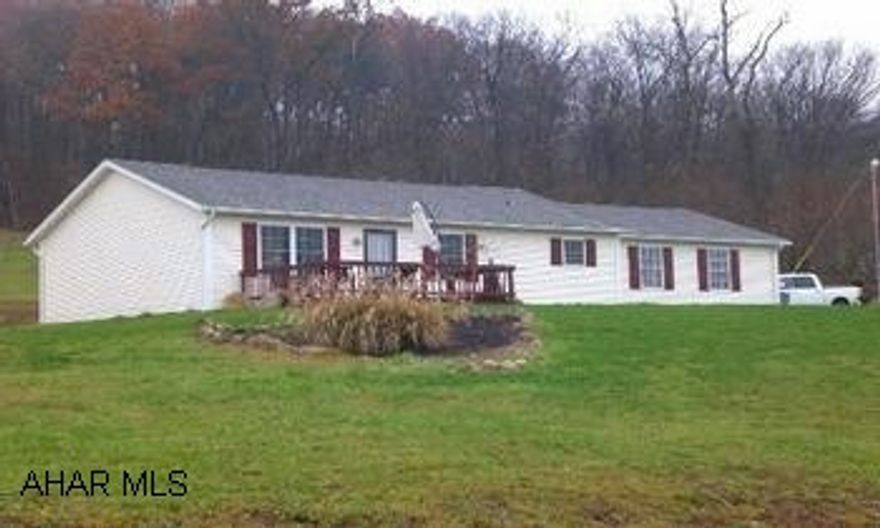 Impressive ranch home with many upgrades.  This home offers beautiful "Bellawood" hardwood floors, ceramic tile floors, solid surface kitchen countertops, and a lounge-about open floor plan.  It has three bedrooms, kitchen, dining area, living room, bath, and first level laundry.  Attached two-car garage with a storage area above.  Large country lot with fantastic countryside views.(DIRECTIONS:  From Bedford, take Richard Street to Sunnyside Road.  Follow straight for approximately three miles to the property on the right side of the road.)