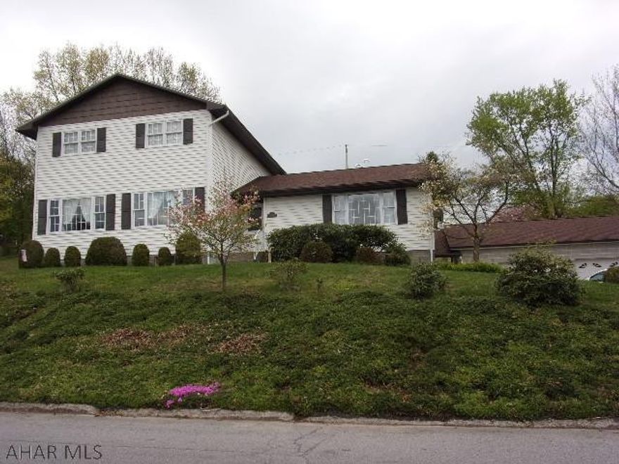 Super 4BR, 1.75 BA home with finished basement, central air, HW heat and in very good condition.  This home has a 12 x 24'  Four season room leading to a concrete patio and huge yard.  Central air, HW heat.  Adding to the special features of this fine home is an attached 4 room in-law suite which has a modern kitchen, bright living room, 3/4BA and bedroom.  Separate entrance for privacy and convenience.  This one has been lovingly cared for by one family since construction in 1974.