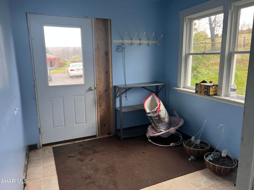 Two story vinyl sided home with detached two car garage and a 40 x80 one story metal barn. The home contains 4 bedrooms, eat in kitchen, office, living room, utility room and bath. This home has been converted to an Amish home and can be converted back. Nice private location.