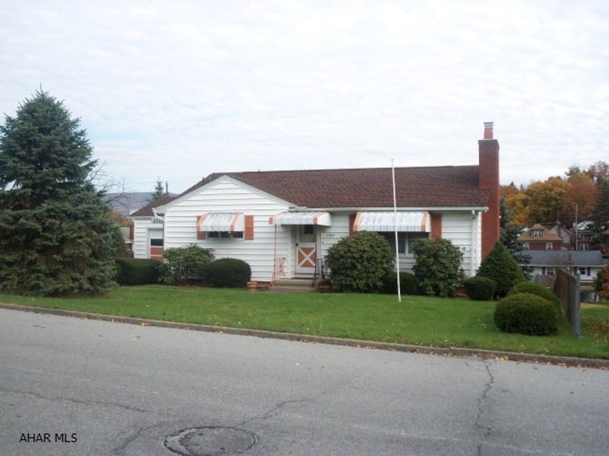 Very spacious ranch on corner lot in Beautiful Calvert Hills! Spotless hardwood floors, fireplace, vinyl siding, almost new roof, furnace, hotwater tank! Pre-inspected - Home, pest and radon inspections ON FILE! 3 Bedrooms, 2 1/2 baths, nice closets, Great screened/closed-in Sunroom, 2 car detached and 1 car attached garages, fenced yard, central air, 2 kitchens, Tons of SPACE and beautiful views! THis is a NICE property, DON'T WAIT!