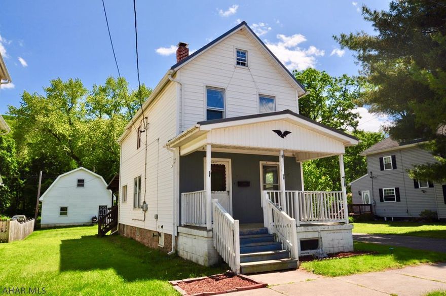 Wow! This quaint 2 1/2 story has a lot going for it! Near impenetrable exterior with hearty metal roof and aluminum and vinyl siding, lots of hardwood floors, large bathroom, full attic and basement. A huge 2 story, 2 car detached garage is accessed by the rear alley. So much potential here, and all at a very reasonable price. See it today!