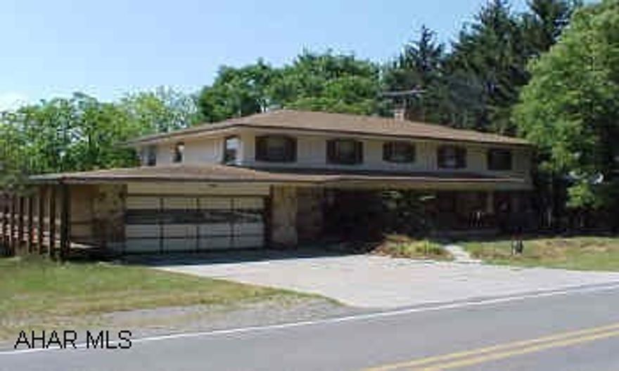 Must See!!  New roof, stone and wood sided, beautiful lot- two decks 5 BR, 4 Bath, a wraparound deck, large room, finished basement with eat in kitchen on .89 acre level lot. Air cond central & window.  Exterior Brick/Stone-Wood. Must See!!  New roof, stone and wood sided, beautiful lot- two decks 5 BR, 4 Bath, a wraparound deck, large room, finished basement with eat in kitchen on .89 acre level lot. Air cond central & window.  Exterior Brick/Stone-Wood.