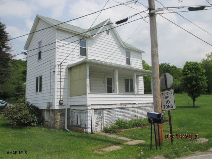 Large 1+ acre lot on the outskirts of town with public water and sewage.