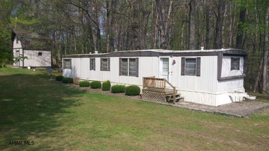 Spotless singlewide on 1.9 private acres. Close to Shawnee State Park.