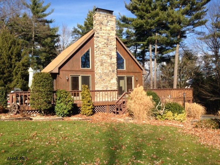 Contemporary country home, secluded but easily accessible to Rt 70 and 76. Well built and well maintained. Beautiful views, great landscaping, wrap around deck, paved drive. Stone fireplace in open living room, kitchen, dining room. Loft overlooking living room. Two and a half baths and 3-4 bedrooms. Truly a unique home in a beautiful setting!