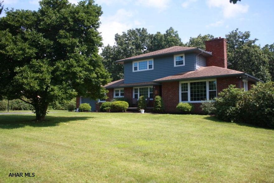 Space and sunshine abound in this pristine 2 story in Hollidaysburg Schools (Frankstown Elementary). Living room with fireplace freshly painted, formal DR w/hardwood floors, spacious kitchen with oak cabinets, corian counters, eat-in area and sitting room that opens to huge covered patio. Inground pool with new pump and heater. New master bath tile, tub enclosure, new windows, new central air, new holding tank for well. Huge family room in lower level complete w/wet bar, fireplace, half bath. A must see!! (Brand new hot water tank 8/12/2015) Motivated seller!