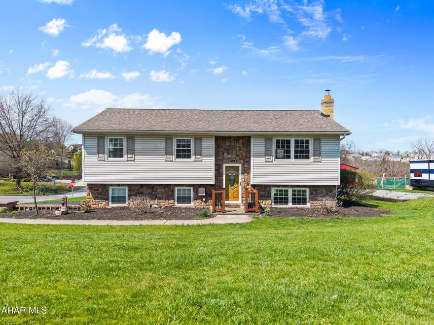 Penn Farms Estate stone and vinyl bi-level home in move-in ready condition! Features  open floor concept including beautiful kitchen with large center island & pantry, adjoining dining area and living room combo. Finished basement includes large family room with brick fireplace and insert, laundry room, 1/2 bath plus bonus storage room. Bonus room was formerly one garage stall that could be converted back to 2 car garage. Energy efficient mini-split system for cooling, ADT security system and parking area for RV w/ 220V outlet.  Large wood deck, concrete patio and storage shed. Deed restrictions apply. Better check it out!