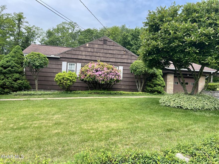 Welcome to 844 Park Avenue, Windber!   This one has it all!  Quiet street sitting well above the town.  Spacious beautiful home! A great lawn to enjoy.  3 BR, 2 bath. with a finished lower level to enjoy or entertain in.  A breezeway to enjoy connects to the attached garage.  Lovely side porch.  Sits on over two lots. Short walk to Windber recreational park with pool/ballfields.   Call today for your showing!