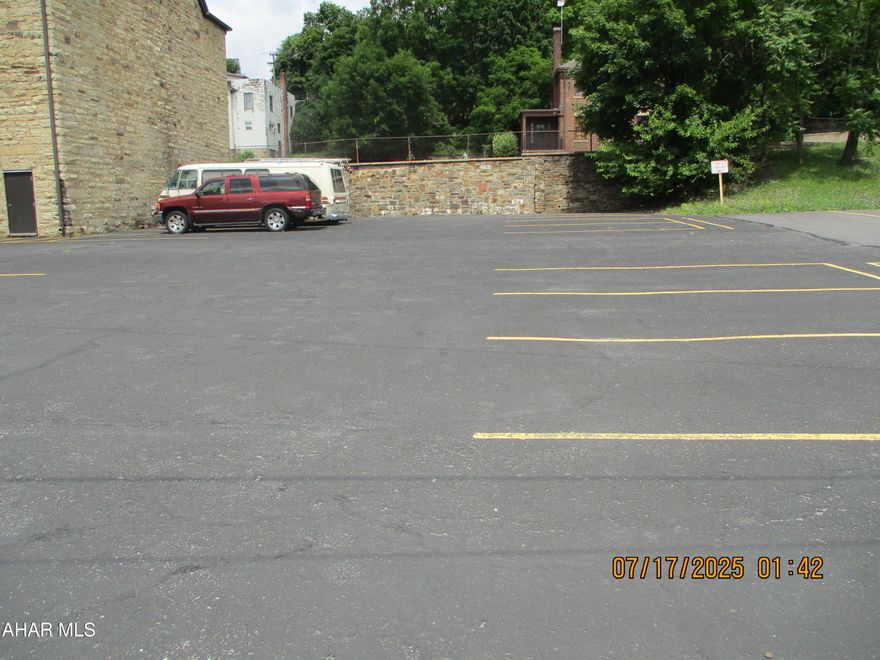 Paved parking lot accommodates 18 vehicles, centrally located.  Easy access from 15th Street.