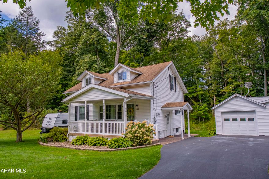 This Sinking Valley property is practical and comfortable, featuring four bedrooms and one bathroom with updated flooring throughout. The kitchen is equipped with stainless steel appliances and butcher block countertops. The living room receives plenty of natural light from a large window. Two bedrooms and the main bathroom are on the first floor, with two additional bedrooms upstairs. The unfinished basement offers storage space. Outside, there's a detached two-car garage, and the property includes a one-acre lot with a covered front porch and a view of the surrounding area. A small stream, Sinking Run, flows through the backyard, but the house is not in a flood zone. A Matterport 3D virtual tour is available for more details. Schedule a showing today.
