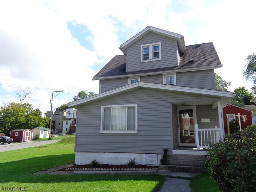 Very nice corner lot and a parking pad for 5 cars, RV, or boat plus a 2 car detached garage with this home.  Skylight in kitchen, spacious living room.  Finished attic is used as a bedroom with a walk in closet.  All appliances are included.  There is also a fire pit & central air.