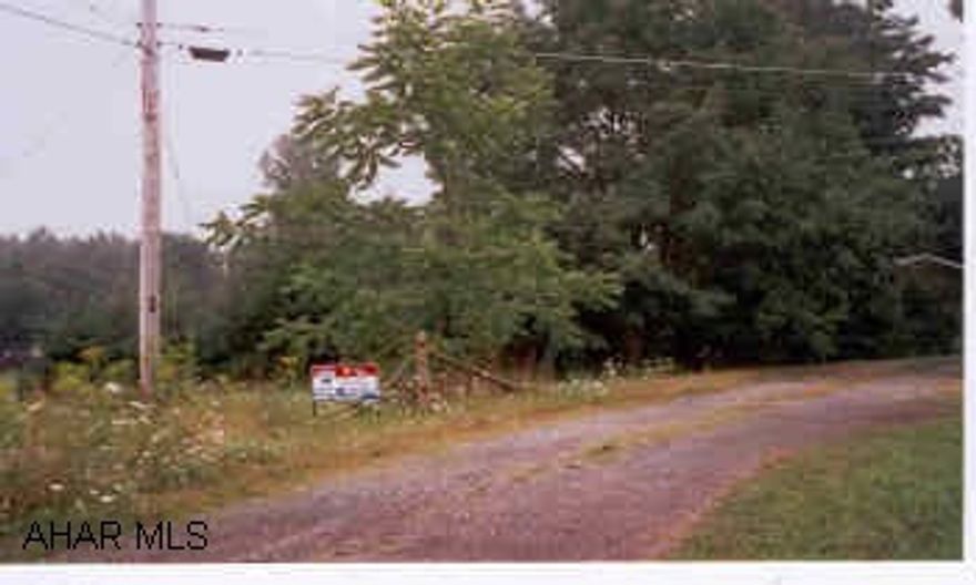 11.79 +/- acres mostly wooded.  Good for homesite or hunting area.  Sewer line through property with sewer tap available.  Owner says tree blind goes with property.