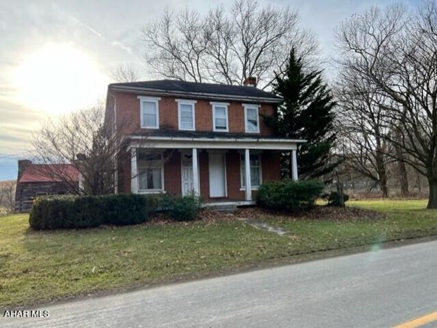 Brick home on 1.4 acres with 2 car garage and small log outbuilding  Three bedrooms, 2 bath with a beautiful fireplace in kitchen, large rooms, and first floor laundry.  With a little TLC, this stately property would make a beautiful home.