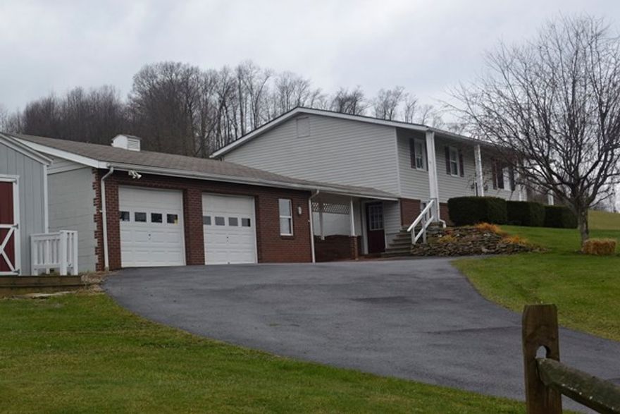 Attractive, well maintained split entry & 2 car detached garage. 3 BR, 1 full bath &  3/4 bath. Hardwood floors, natural gas heat. finished basement.  Fireplace in game room