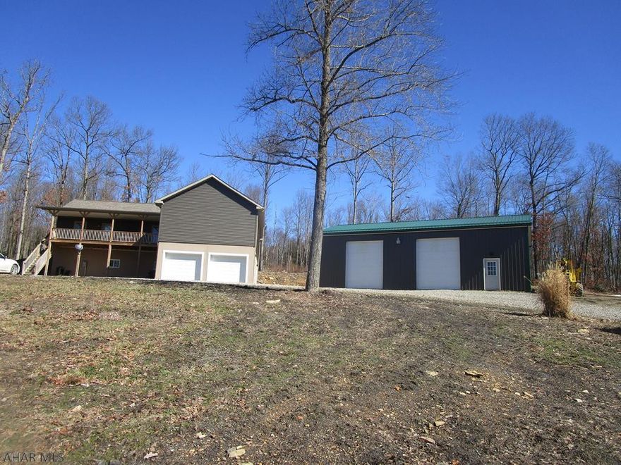 Private location Horse farm on 71+ acres with a beautiful 2014 modular home. The home features 3 bedrooms and 2 baths, large open concept kitchen with abundance of oak cabinets, separate laundry room and large living room. Front and rear decks. Basement is superior wall foundation with 10' ceiling height. 2 car integral fireproof garage. To save on heat costs there is an additional coal/wood furnace that heats garage and house. 30x50 as new garage includes insulation with 14 ' ceiling height and concrete floor. Outside dog kennel.  Horse barns with 6 stalls and pastures. Arena measures 100x200 for riding along with a round pen (needs fencing). Workshop building includes a walk in cooler. Private setting with plenty of deer. Truly a remarkable property for those who want country living!