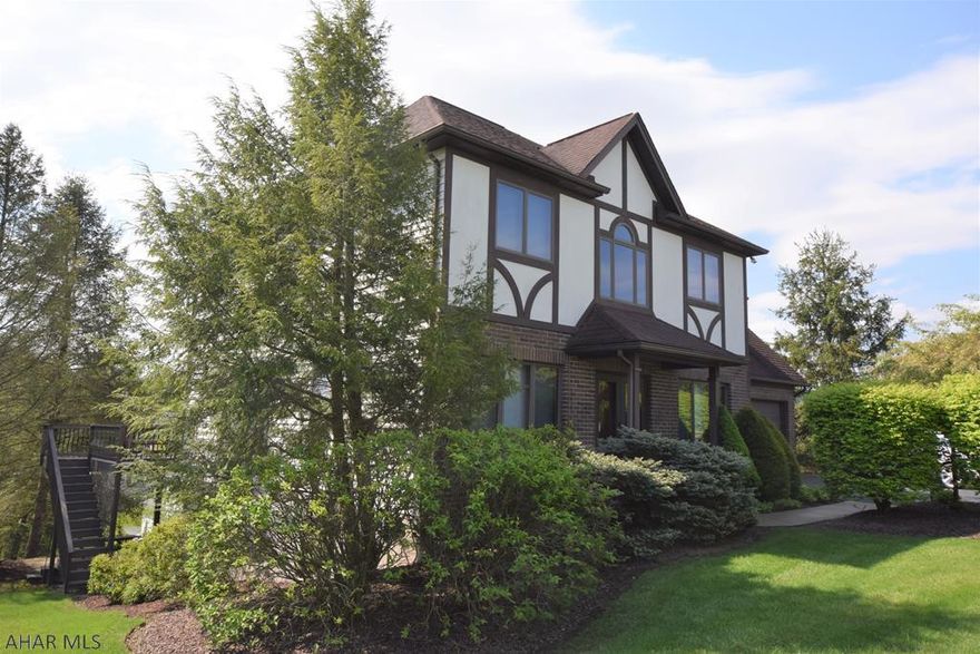 This beautiful home has the open floor plan and upgraded amenities you are looking for.  9 ft ceilings.  Hardwood flooring throughout the main floor.  Kitchen has granite counter tops, center island, butler pantry, and opens to the first floor family room with gas fireplace.  Enjoy the beautiful view and change of seasons from the large window at the breakfast area. There is a large rear deck accessed from this kitchen area.   Spacious dining room and private living room with glass wall and door that would be well suited for a music room or private office.  Second floor features three bedrooms plus a master suite with walk-in closet and updated master bath.  Lower level has family room with gas fireplace and wet bar, 3/4 bath, and plenty of good storage.