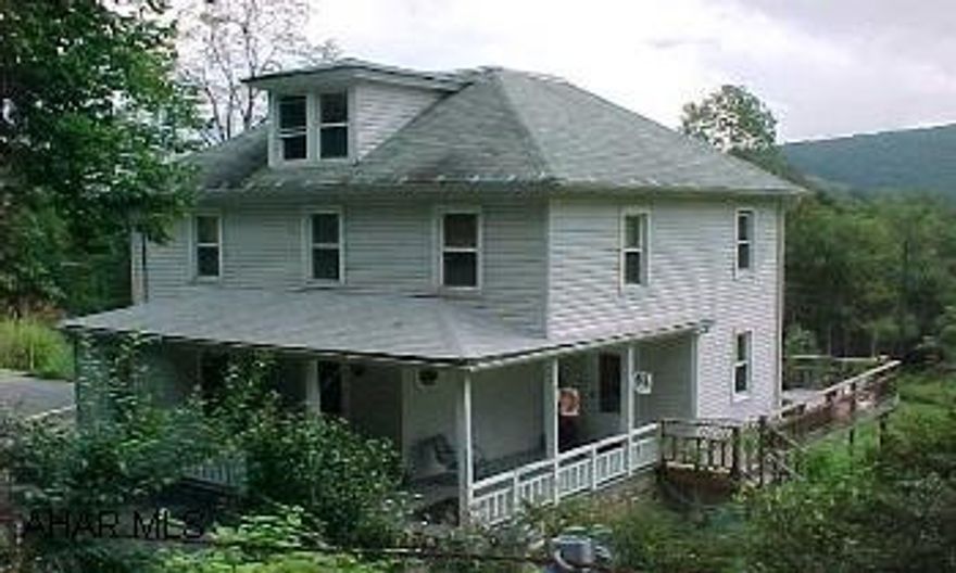 Nice farmhome with country charm. Gorgeous views of the mountains from the large covered rear deck. Custom milled wood walls in the kitchen and built in hutch. Heat is oil and also a kerosene burner-gravity fed that is great when there is a power outage. Newer windows, central air, furnace , and new well  November 2006 and other updates.  Call for complete list. Call DIANNE 329-1856.