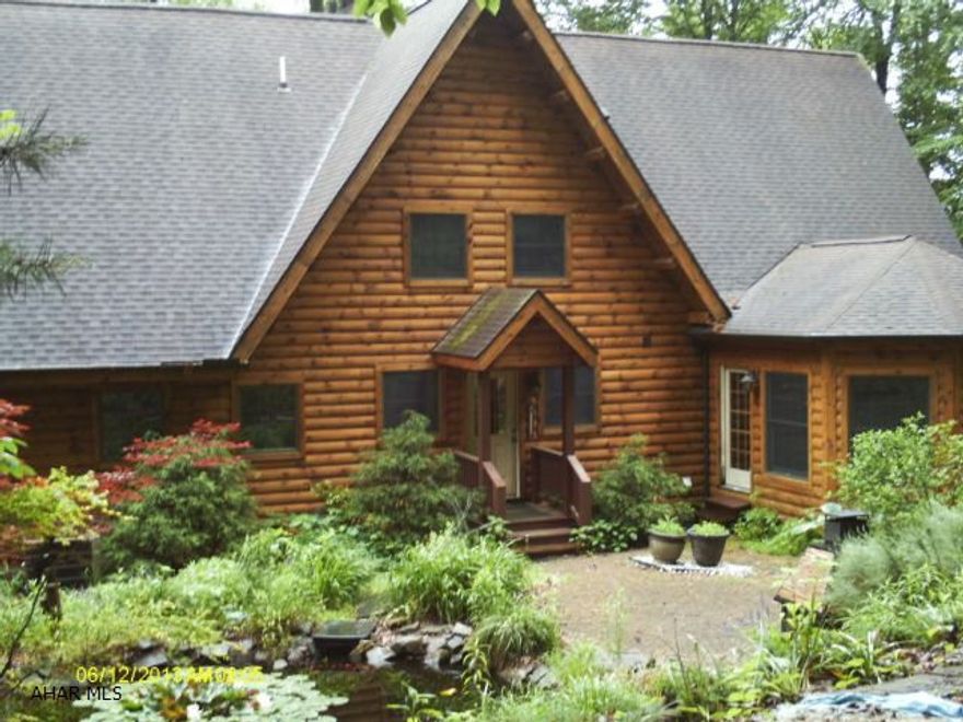 Stunning Kuhn Bros. Log Home. 5 bedroom, 4 bath, gourmet kitchen, stainless appliances, spacious breakfast nook, seperate dining area, cathedral ceiling in great room, floor to ceiling stone fireplace, central vac, 2 car garage, with bonus room above, all sitting on 5 acres of ground, 4000 + square feet.