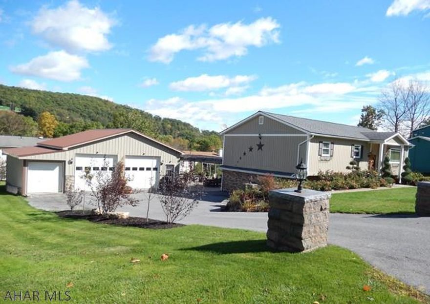 Totally updated 4 bedroom home in Eldorado. This home, with many amenities, is sure to please inside and outside. 2 1/2  car oversized, heated garage with workshop  34 X28. The outdoor living includes professional landscaping that has low maintenance shrubs and perennials, with low voltage lighting. Its even stunning in the evening. Enjoy the beautiful patio with Pergola, outdoor kitchen and fire pit. Then cool off in the above ground pool (18 foot round) with new deck.. All materials used in this oasis are top quality and sure to please! Inside: Beautiful Dry Stacked Stone fireplaces and accent, open floor plan, three season room, large family room ....all updated with style. Hot water heat and central air.  This home Is a must see!