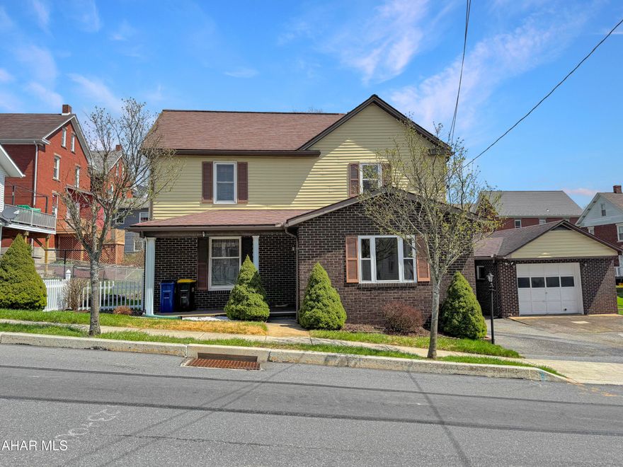 Welcome to 208 S Julian Street in the charming Ebensburg Borough! This stunning home is situated on a desirable double lot & boasts a wealth of incredible features for the money. As you step inside, you'll be welcomed by a spacious foyer that leads into an expansive dining room & a large living room—perfect for entertaining guests. The eat-in kitchen is equipped w/ ample cabinetry, making it both functional & inviting. This level also includes a convenient half bath, a laundry room, & a cozy heated sunroom, ideal for relaxation year-round. Upstairs, you'll find three generously sized bedrooms, along w/ a full bathroom. The basement is nearly fully finished, presenting an excellent retreat or an ideal mother-in-law suite. This fantastic space features a welcoming living area, a full bar complete w/ a kegerator, a full kitchen, a ¾ bath, & plenty of storage. Additionally, the attic is partially finished, providing even more storage options. Outside, you'll appreciate the off-street parking, a detached oversized one-car garage w/ a full basement & workshop, & a fully fenced rear yard that offers privacy for gatherings. Enjoy warm evenings on the large deck, & take advantage of the additional shed for your outdoor equipment. Don't miss out on this incredible opportunity! Call today to schedule a viewing!